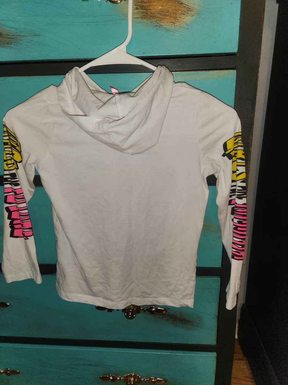 Justice White Graphic Hoodie with Pink and Yellow Accents